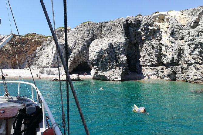 Rhodes Exclusive Swim Cruise Cocktail Open bar & Gourmet Buffet - Afandou Beach and the caves zone: pebble shore, ancient raids, and more swimming time