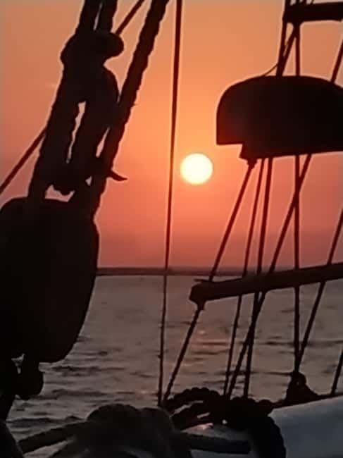 Rhodes: Sunset Cruise 1 hour on an 18th-Century Boat - How the Mandraki-to-Medieval-city view hits at golden hour