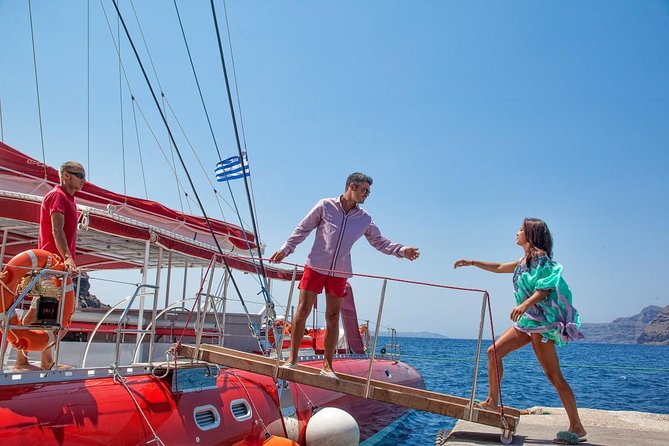 Sailing Catamaran Cruise in Santorini with BBQ, Drinks and Transfer - Red Beach swim: quick look, clear water, snorkel time