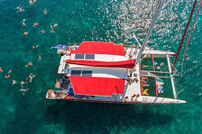 Sailing Catamaran Cruise in Santorini with BBQ, Drinks and Transfer - Sailing the caldera: views, wine, and volcano passes