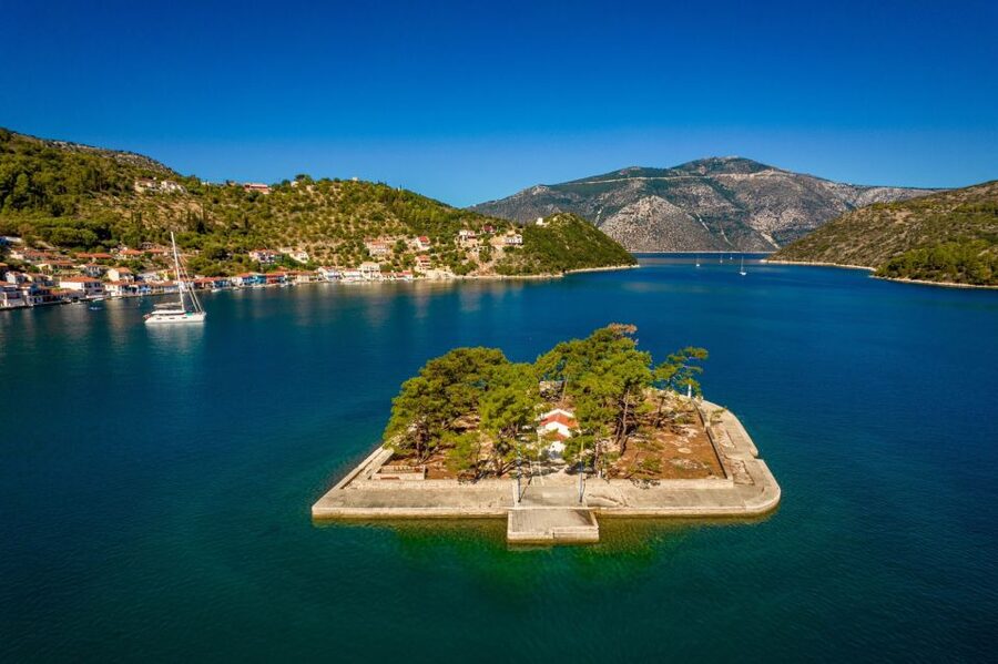 Sami: Ithaca Island Boat Trip with Swimming and Snacks - Filiatro Beach: rocks, turquoise water, and a slower swim