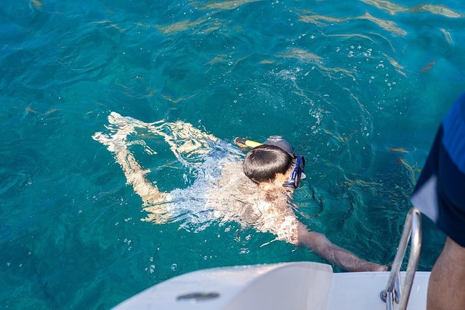 Santorini Adventurous Catamaran Experience with Snorkeling - Nea Kameni hot springs snorkeling: warm water with a volcanic twist