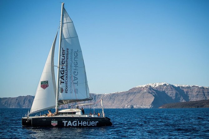 Santorini Adventurous Catamaran Experience with Snorkeling - Lunch or dinner onboard: BBQ, local white wine, and real comfort at sea