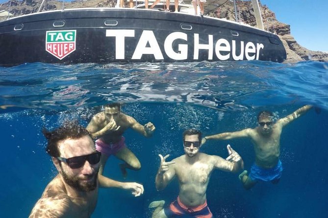 Santorini Adventurous Catamaran Experience with Snorkeling - From hotel pickup to Vlychada: starting smoothly