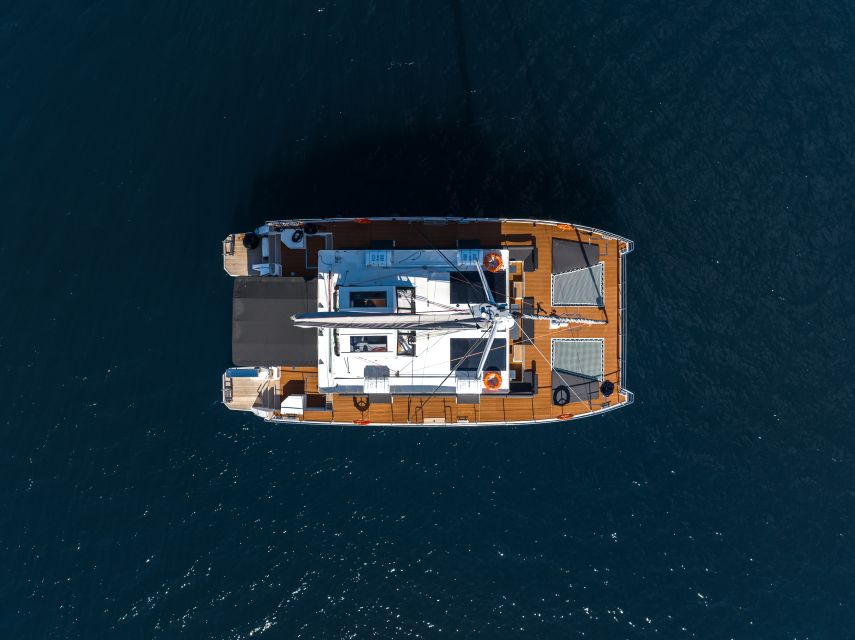 Santorini: Catamaran Caldera Cruise with Meal and Drinks - Red Beach and White Beach: color you can swim in