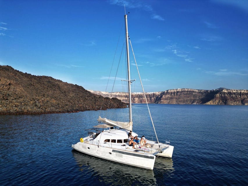 Santorini: Catamaran Cruise with Greek BBQ and Drinks - Red Beach Swim and Snorkel Stop: The One You Came For