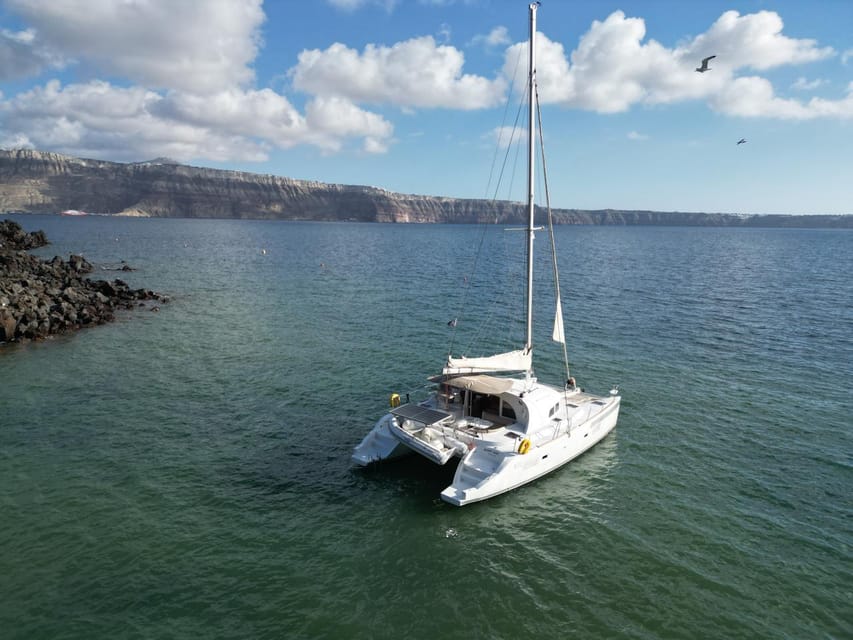 Santorini: Catamaran Cruise with Greek BBQ and Drinks - White Beach and Sea Caves: More Water Time, Better Variety