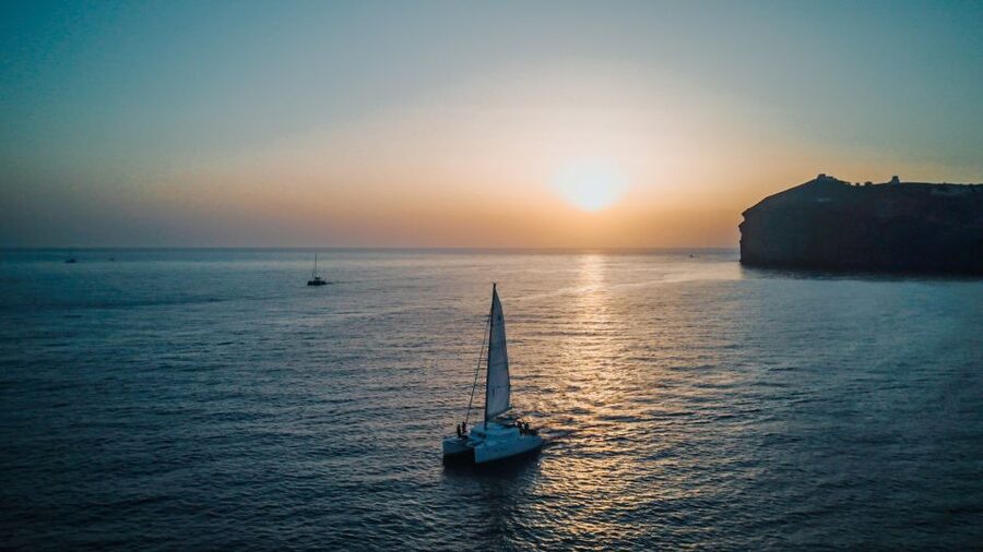 Santorini Catamaran Cruise with Swimming, Meal and Open Bar - Thirassia: swimming, snorkeling, and the main meal break