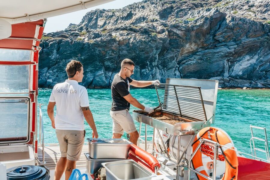 Santorini: Catamaran Tour with BBQ Dinner, Drinks, and Music - What the crew and music add to the experience