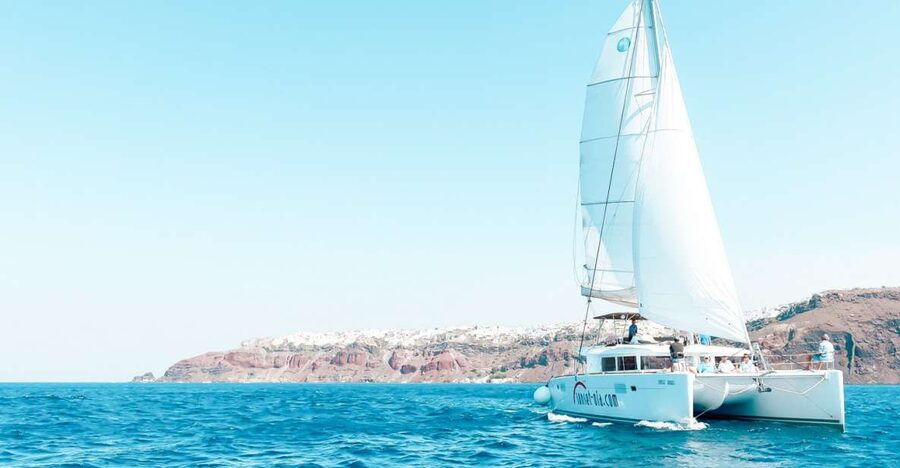 Santorini: Catamaran Tour with BBQ Meal and Unlimited Drinks - Lagoon 450 luxury with a small-group feel that actually helps