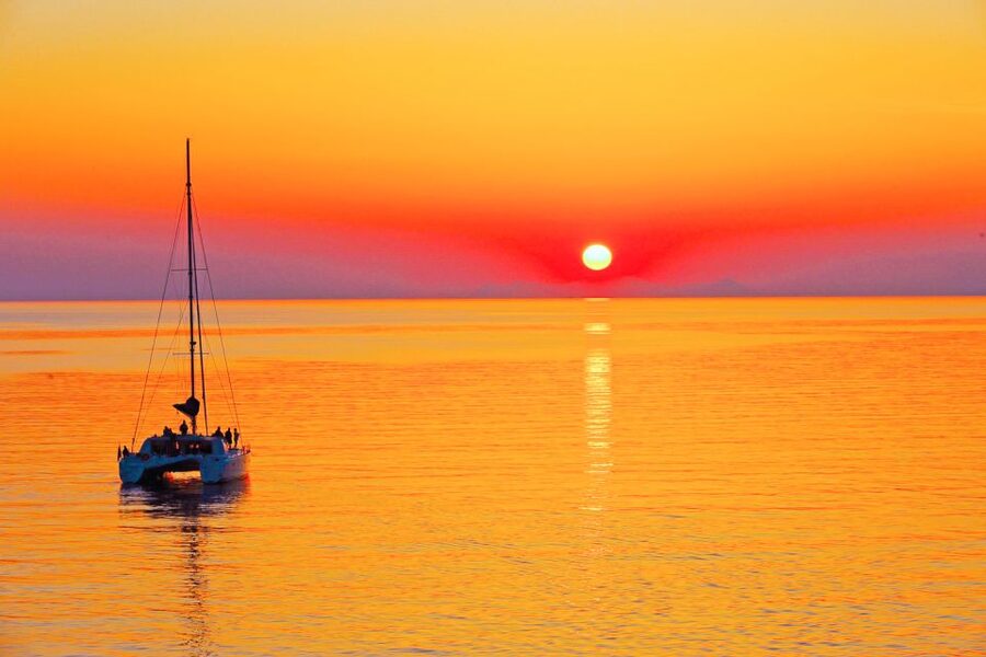 Santorini: Catamaran Tour with BBQ Meal and Unlimited Drinks - Red Beach snorkeling: what to expect under the cliffs