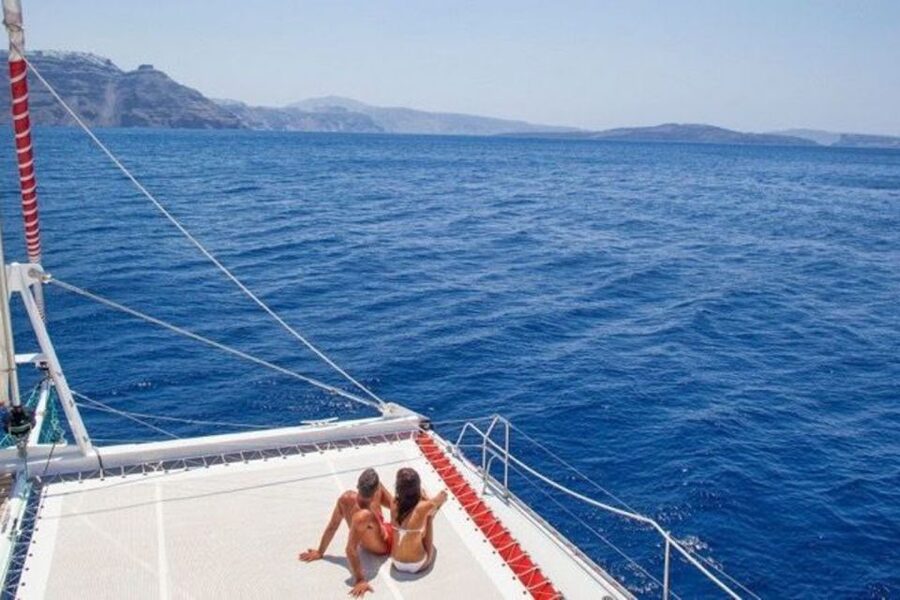 Santorini: Dream Catcher 5-hour Sailing Trip in the Caldera - Guide and crew energy: names you might hear