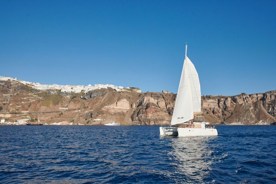 Santorini Gold Catamaran Cruise with Snorkel, BBQ & Open Bar - White Beach and Venetian Lighthouse: Sea-Level Views That Beat the Postcard