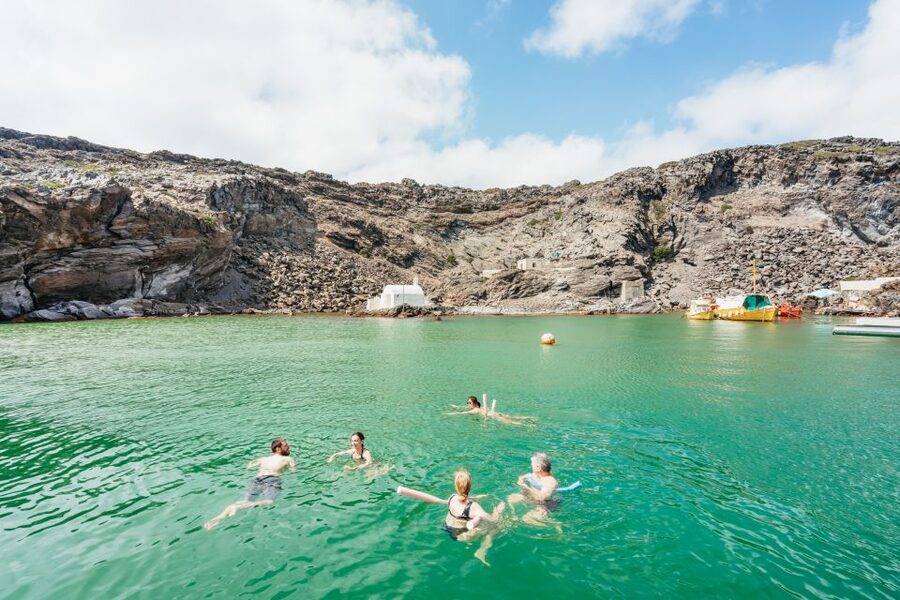 Santorini: Luxury Catamaran Day Trip with Meal and Open Bar - Sailing the Caldera: Volcano Islands, Akrotiri Lighthouse, and Oia Light