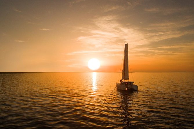 Santorini Luxury Catamaran Sunset Cruise with BBQ, Drink and Transfer - Sailing the volcano zone and Palea Kameni, from the best seat in Santorini