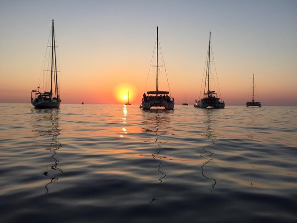 Santorini Luxury Catamaran Sunset Cruise with BBQ, Drink and Transfer - Timing for the sunset: daylight saving and the golden hour window