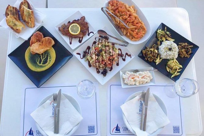 Santorini Luxury Catamaran Sunset Cruise with BBQ, Drink and Transfer - Pickup and ports: Ammoudi, Athinios, and what to expect at arrival