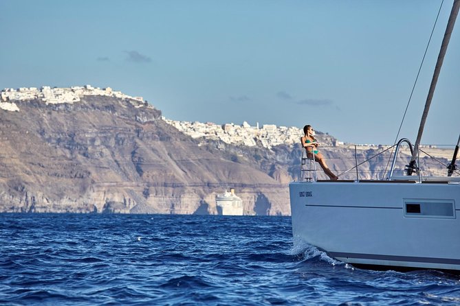 Santorini Luxury Sailing Catamaran Cruise with BBQ, Drinks and Transfer - Sailing Past the Ancient Lighthouse From the Sea