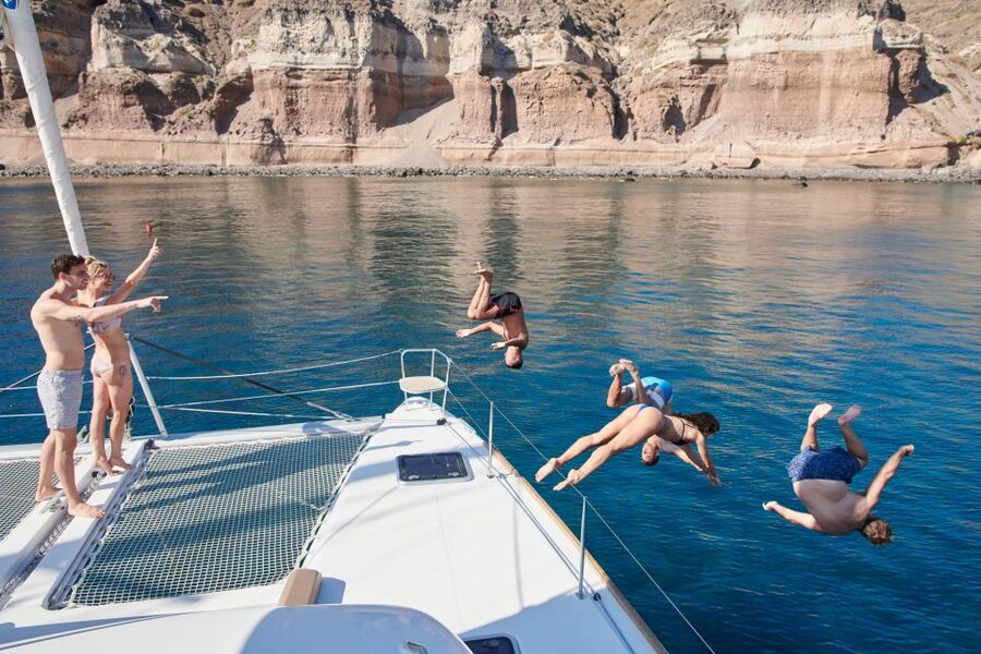 Santorini: Platinum Catamaran Cruise w/ BBQ Meal & Open Bar - A platinum catamaran day on Santorini, minus the crowd stress