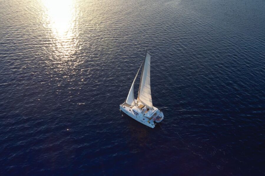 Santorini: Platinum Catamaran Cruise w/ BBQ Meal & Open Bar - Snorkeling gear, towels, and the rhythm of a 5-hour cruise