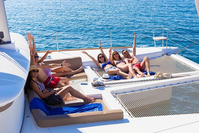Santorini Private Catamaran Cruise with BBQ, Open Bar & Transfers - White Beach: The Boat-Only Swim Stop You Will Actually Remember