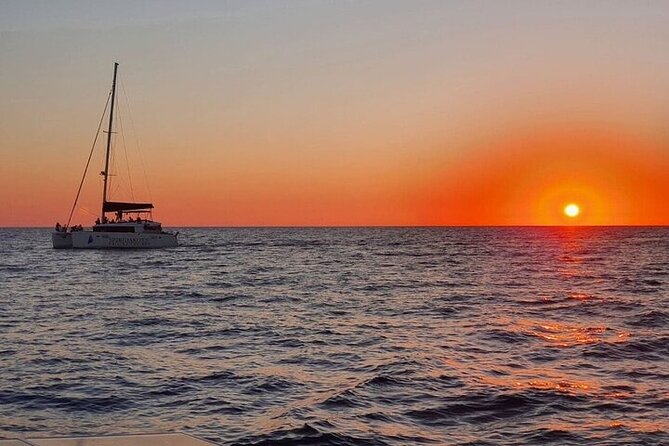 Santorini Private Catamaran Cruise with BBQ, Open Bar & Transfers - Cruising Past Indian Rocks and Caves: Santorini From Sea Level