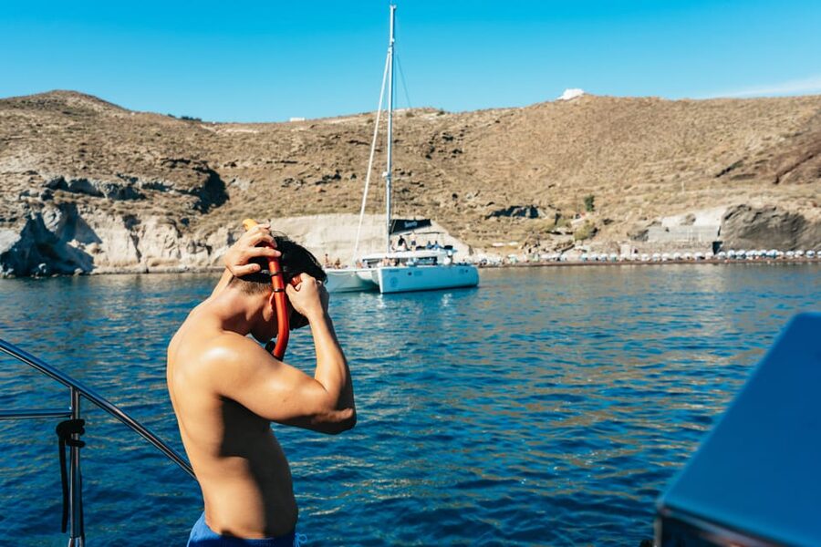 Santorini: Sailing Catamaran Cruise with BBQ and Drinks - What the snorkeling and swim stops are really like