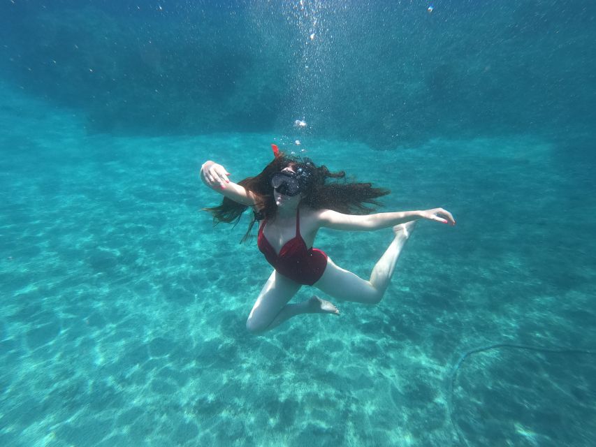 Santorini: Sea Caves Kayak Trip with Snorkeling and Picnic - Akrotiri Coastline Kayaking: Caves, Nooks, and Rock Formations