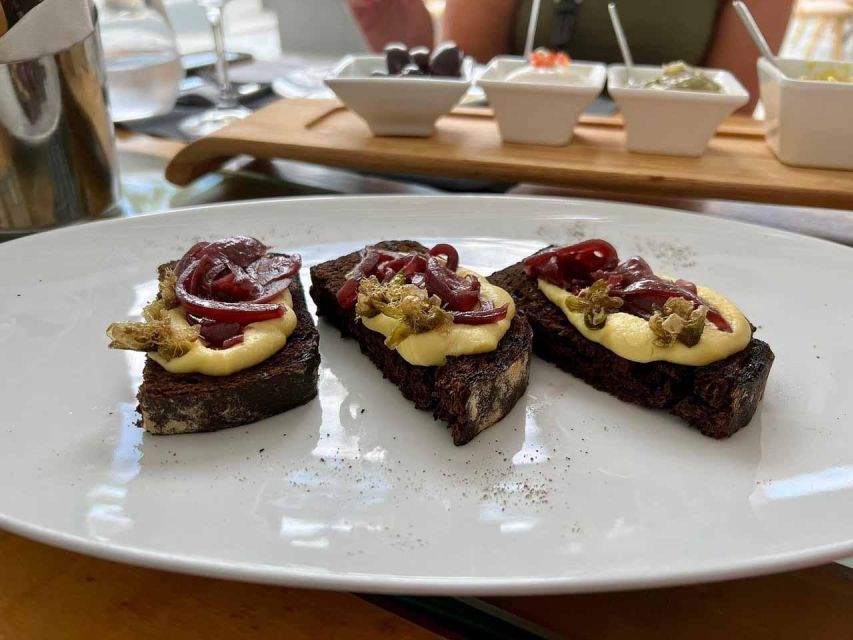 Santorini: Small-Group Sunset Wine Tour with Santo Winery - Cellars, volcanic vineyards, and what the tour teaches beyond tasting