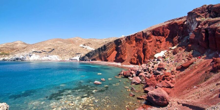Santorini: Sunset Guided Tour with Hotel Pickup - Red Beach: volcanic cliffs, clear water, and a short walk