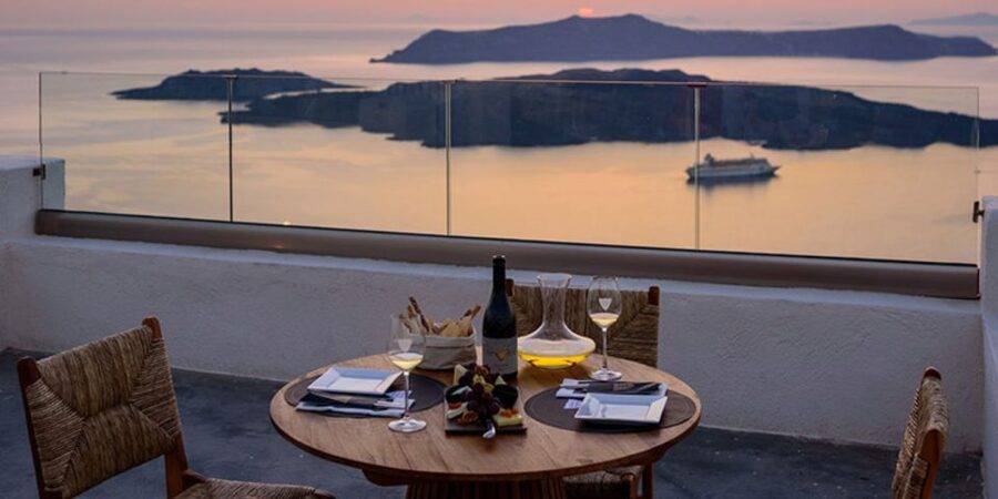 Santorini: Sunset Guided Tour with Hotel Pickup - Akrotiri Lighthouse: a calm photo angle over the caldera