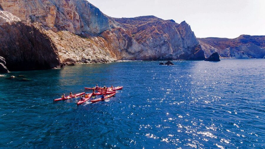 Santorini: Sunset Sea Kayak with Light Dinner - Sea caves and the rocky “Black Mountain” finish