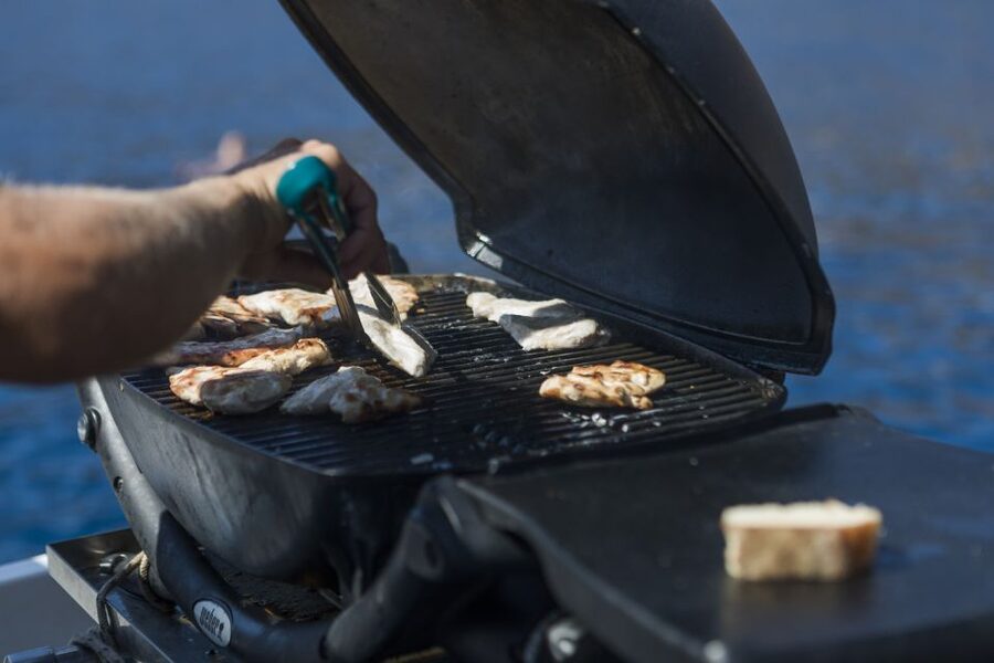 Santorini: Traditional Wooden Boat Tour with Meal and Wine - Key highlights you’ll care about