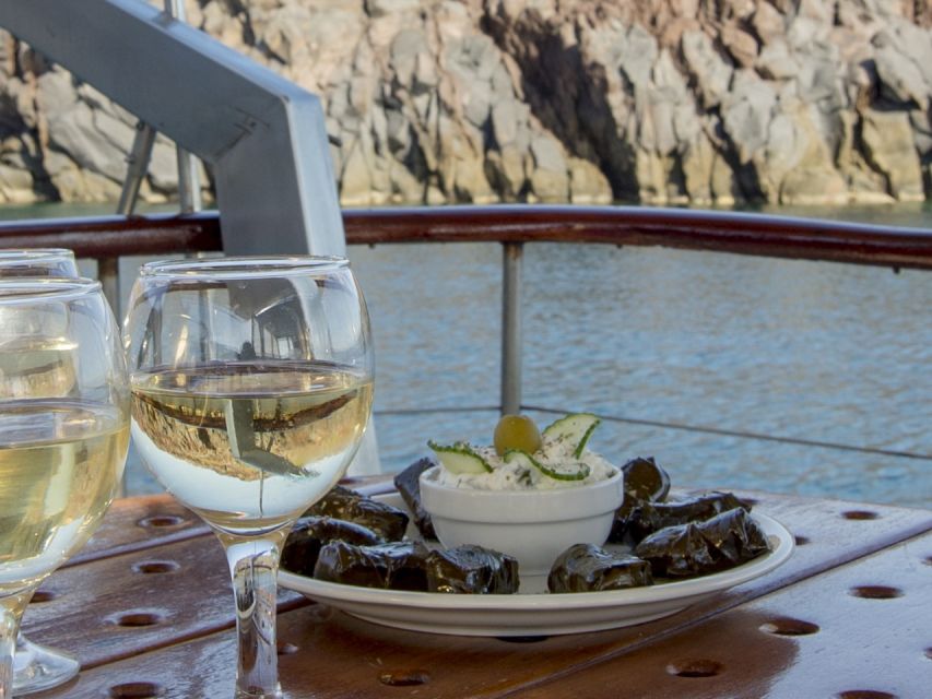 Santorini: Traditional Wooden Boat Tour with Meal and Wine - Pickup to port: air-conditioned comfort, then you step onto the boat