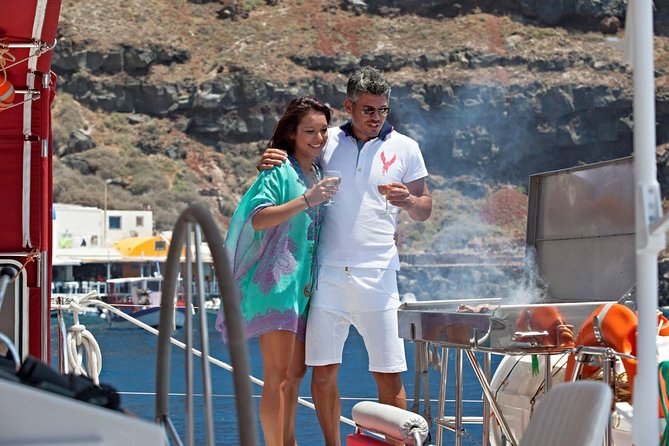 Sunset Sailing Catamaran Cruise in Santorini with BBQ and Drinks - Hotel pickup from anywhere on the island side