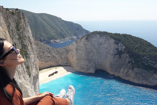 Zakynthos : One day small group tour to Navagio beach Blue Caves & top view - Blue Caves by Boat: The Big Color Payoff and the Glass-Bottom Twist